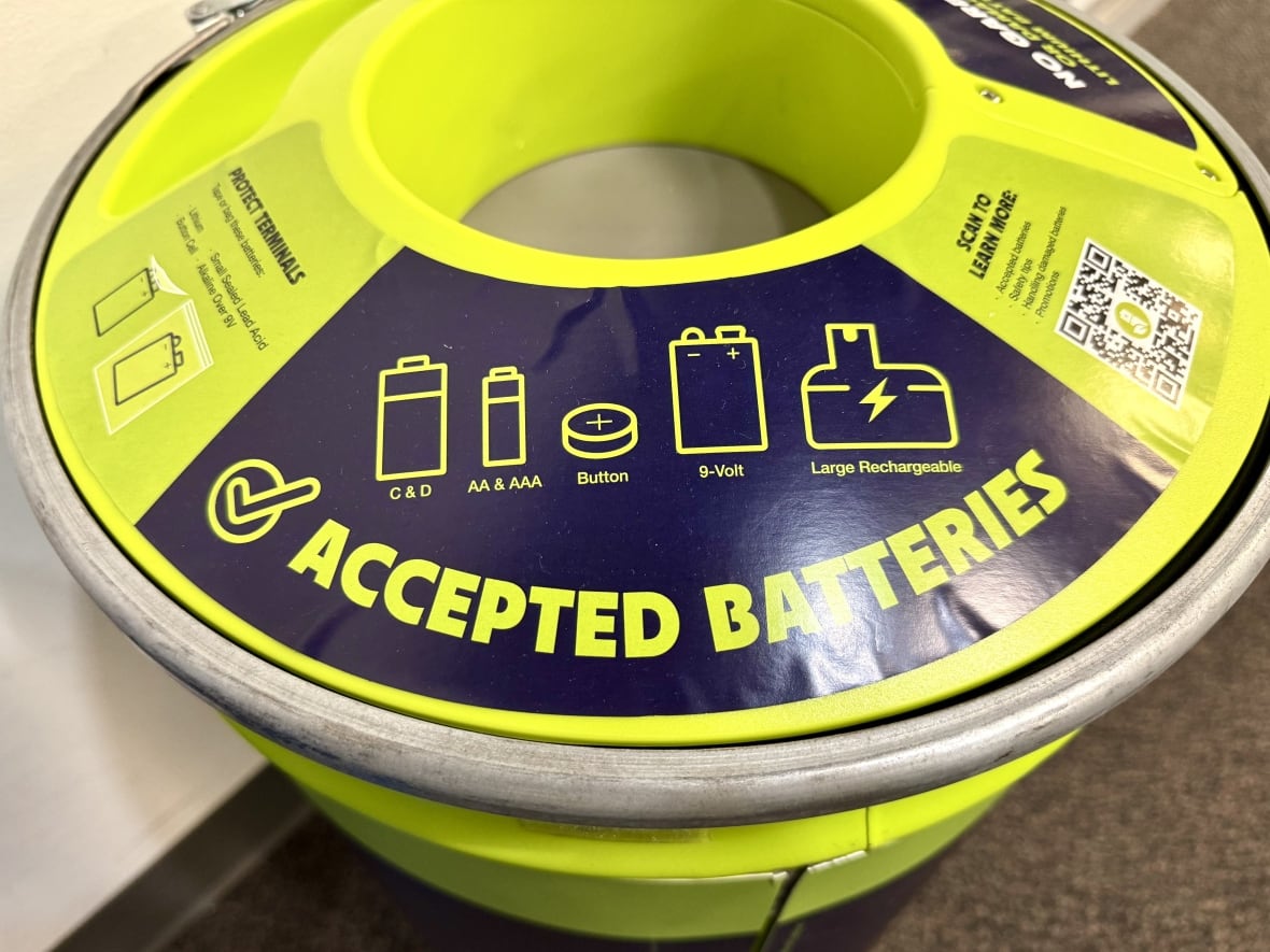 A close up of the new battery recycling container, showing which batteries are allowed to be disposed. They include AA, AAA, C, and D batteries, button batteries, nine-volt batteries, and large rechargeable batteries.