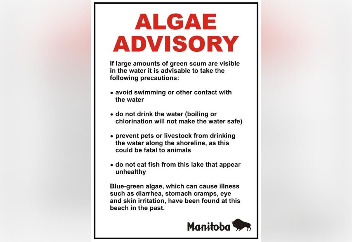 white sign with bright red lettering that reads "ALGAE ADVISORY" in all capital letters