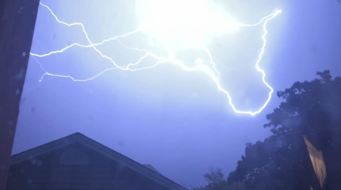 A picture of a night sky lit up by lightening.