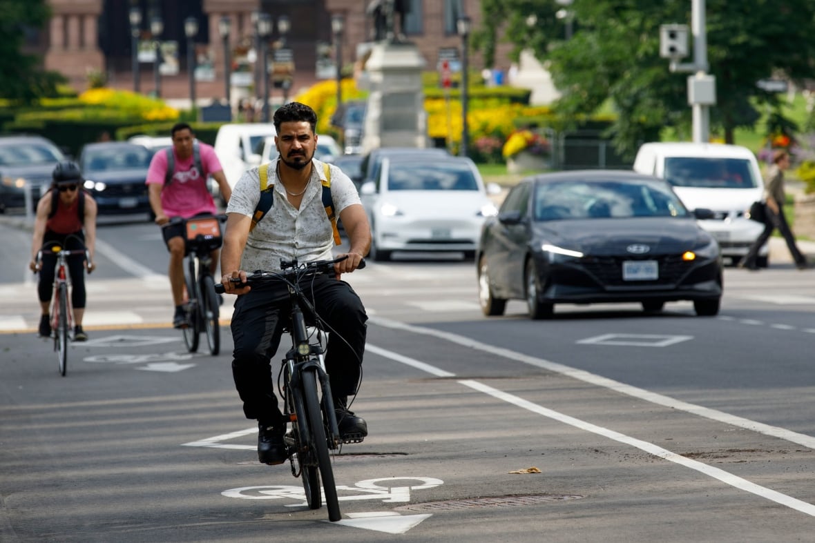 Cyclists are pictured using bike lanes