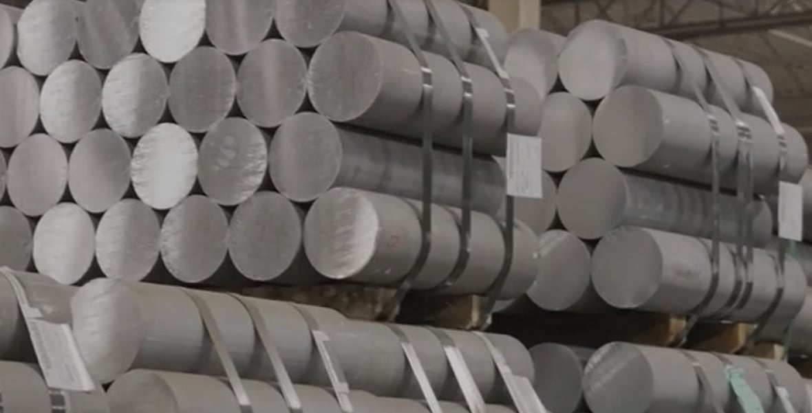 Clusters of aluminum cylinders are piled at Dajcor Aluminum.