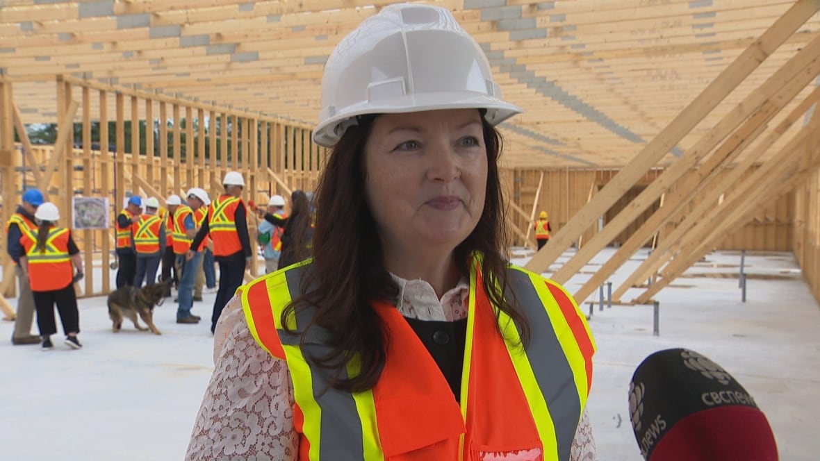 Woman standing inside construction site