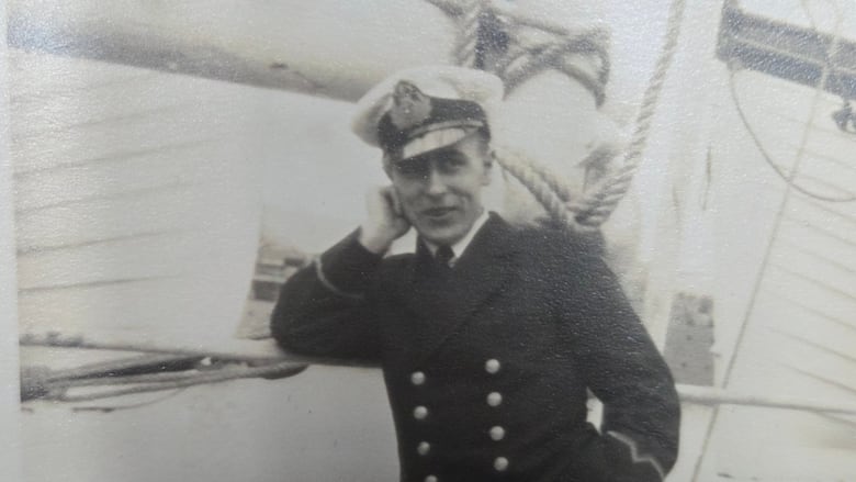 Black and white photo of a military sailor in uniform.