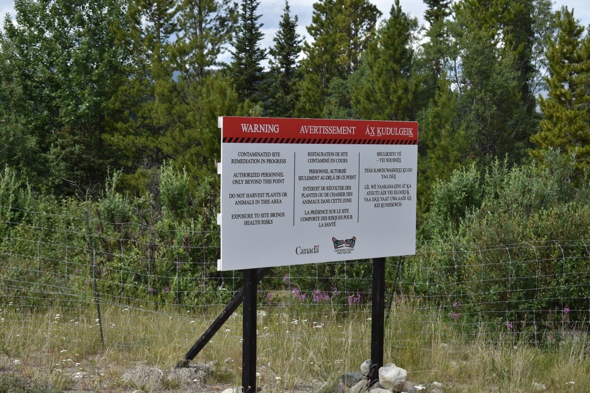 A warning sign at the side of a road.