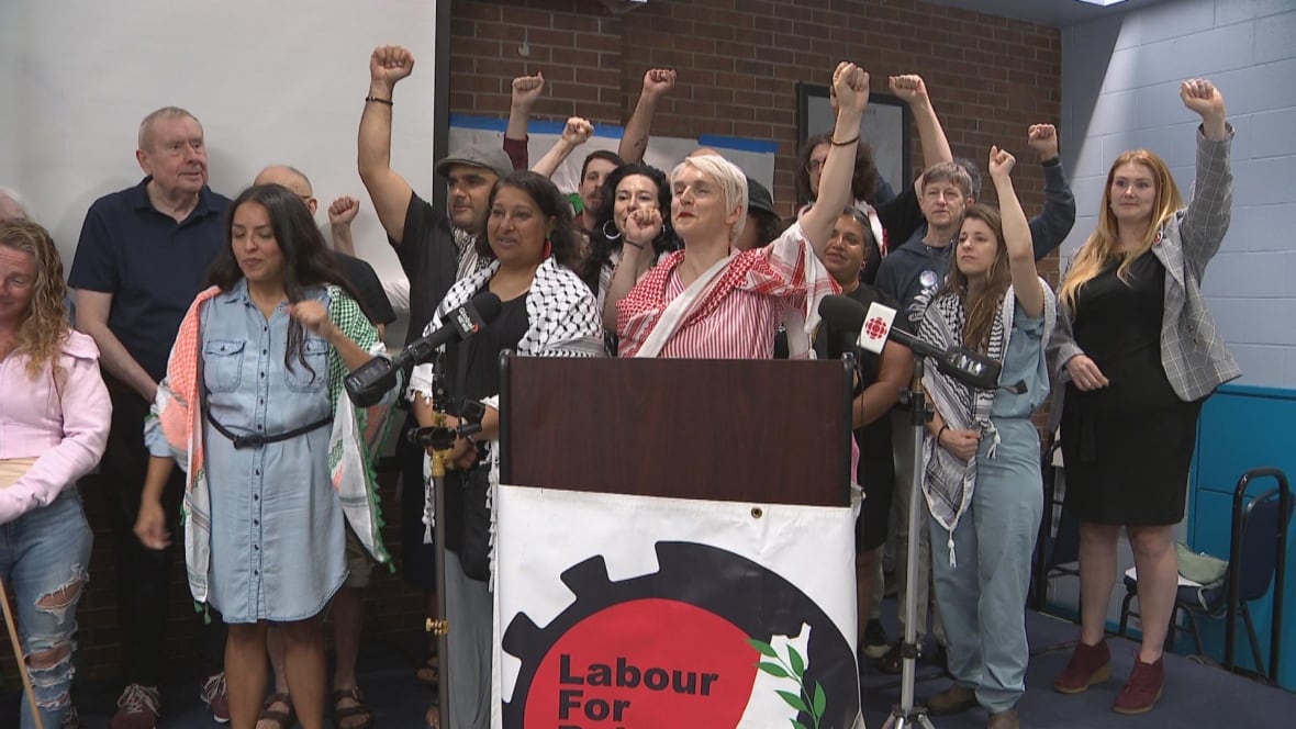group of people raising their arms