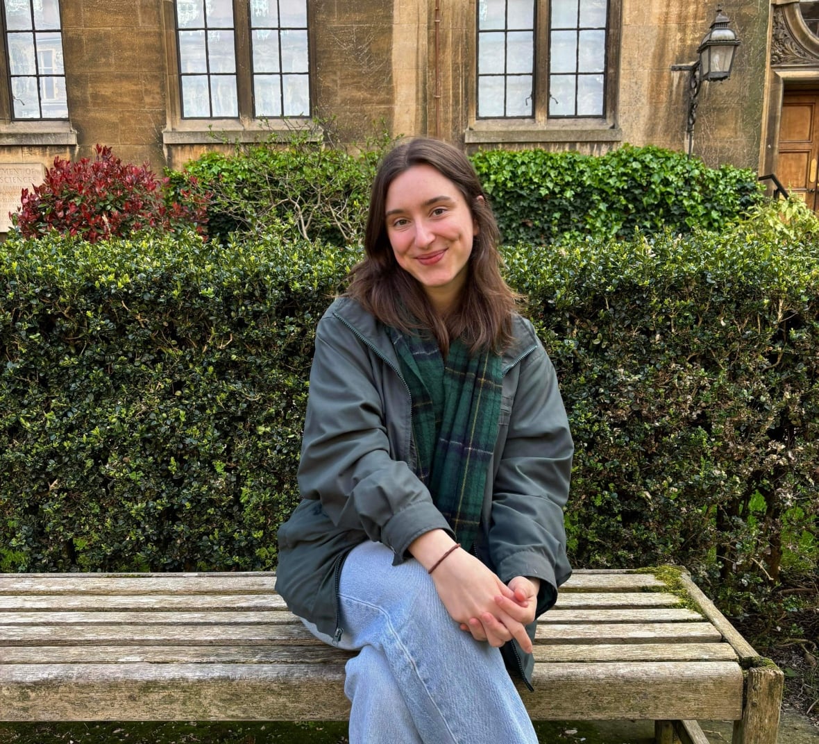 Photo of Anaïs Pronovost-Morgan sitting on a bench.