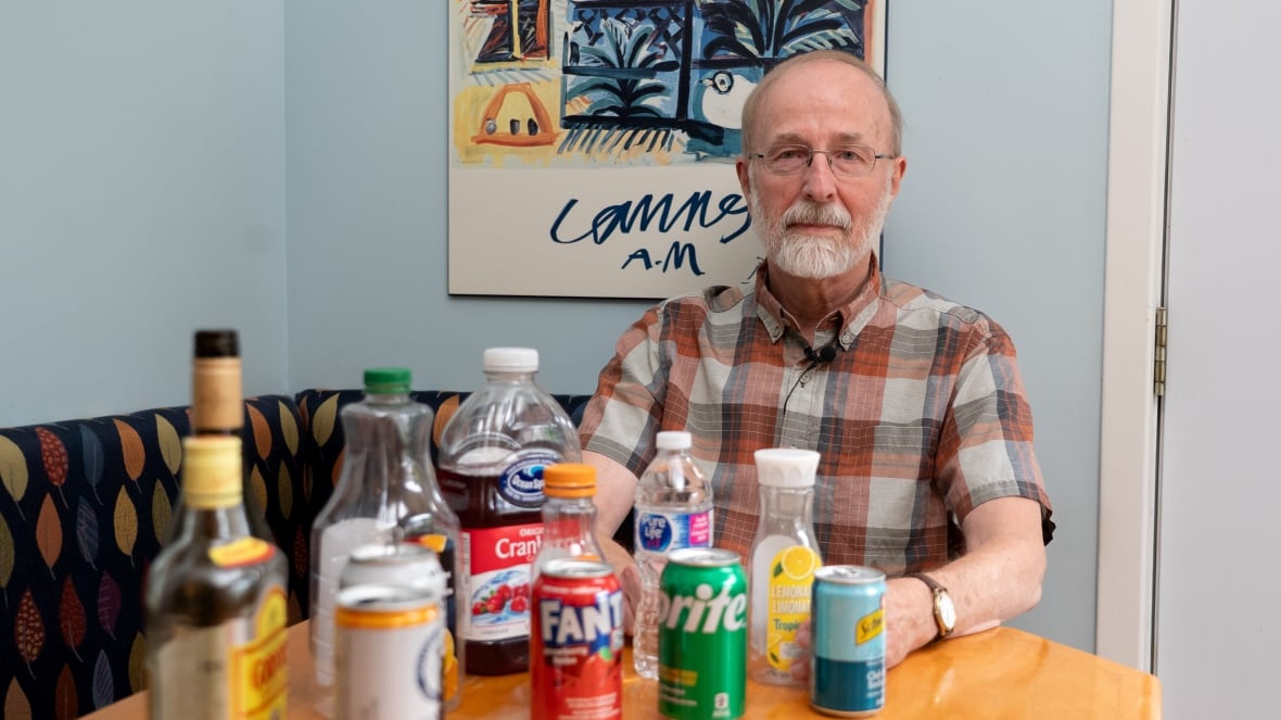 A man with bottles and cans