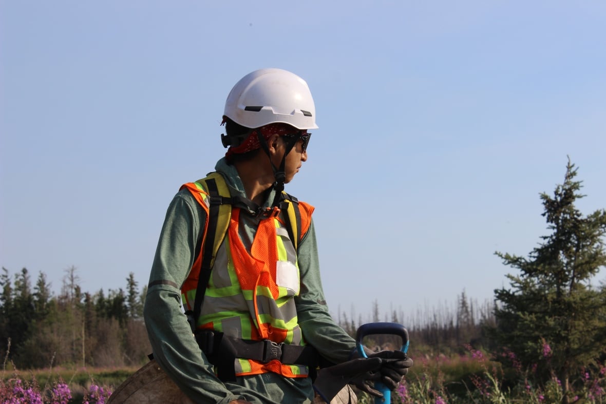 A man in tree planting gear and sunglasses.