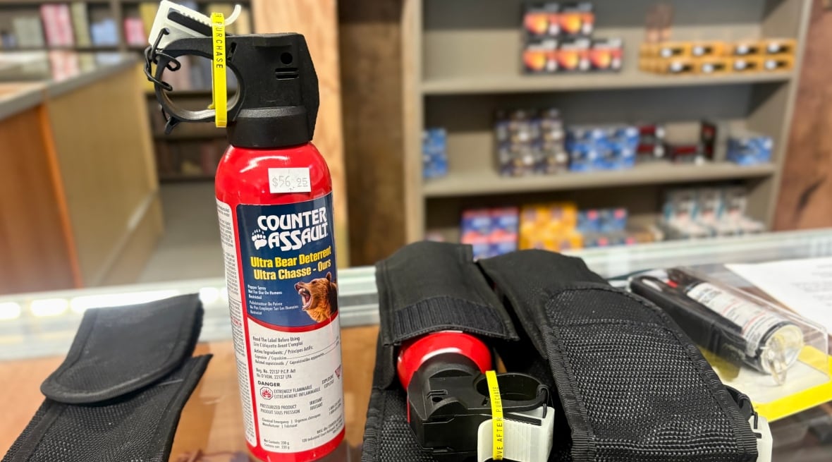 A canister of bear spray on a countertop.