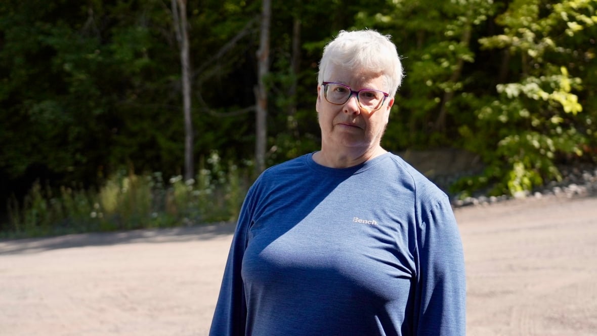 A woman in a blue sweater