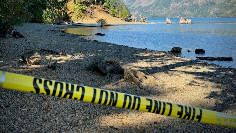 Police tape at a beach