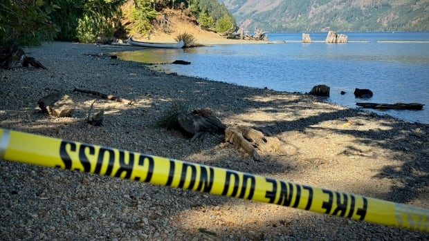 Police tape at a beach
