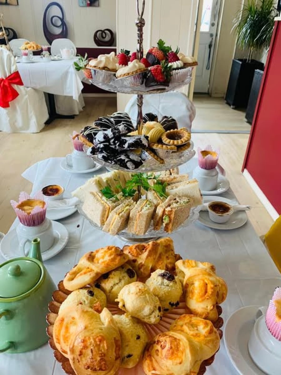 A three-tiered tray offers snacks.