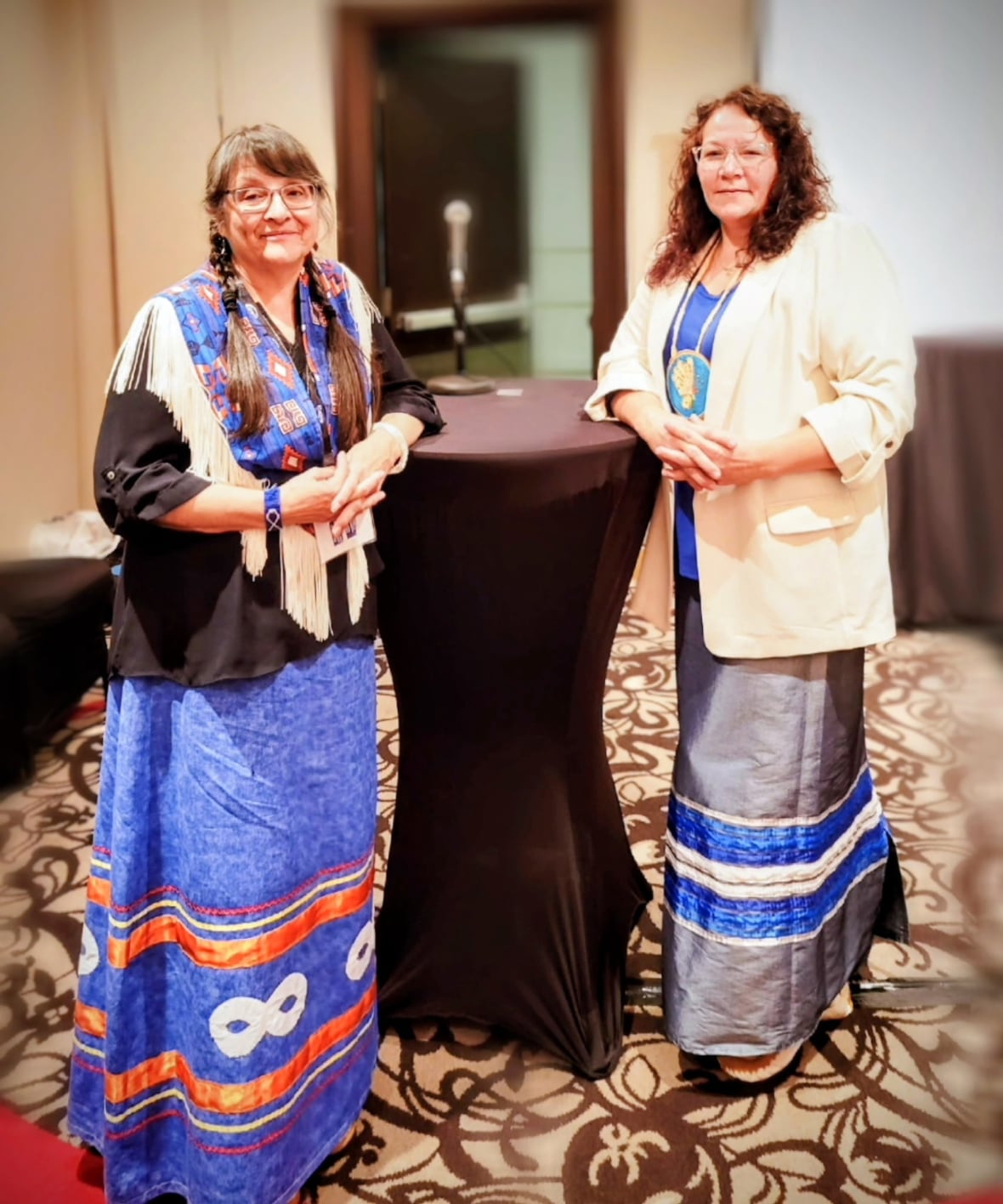 A picture of two women standing together. 