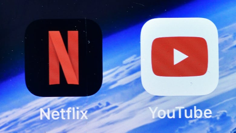 App icons for Netflix (a black square with rounded edges and a large, red N in the centre) and YouTube (a white square with rounded edges and a red rectangle in the centre around a white, right-pointing triangle). 