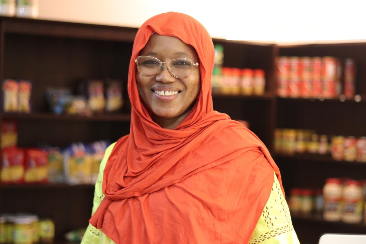 A woman smiles at the camera