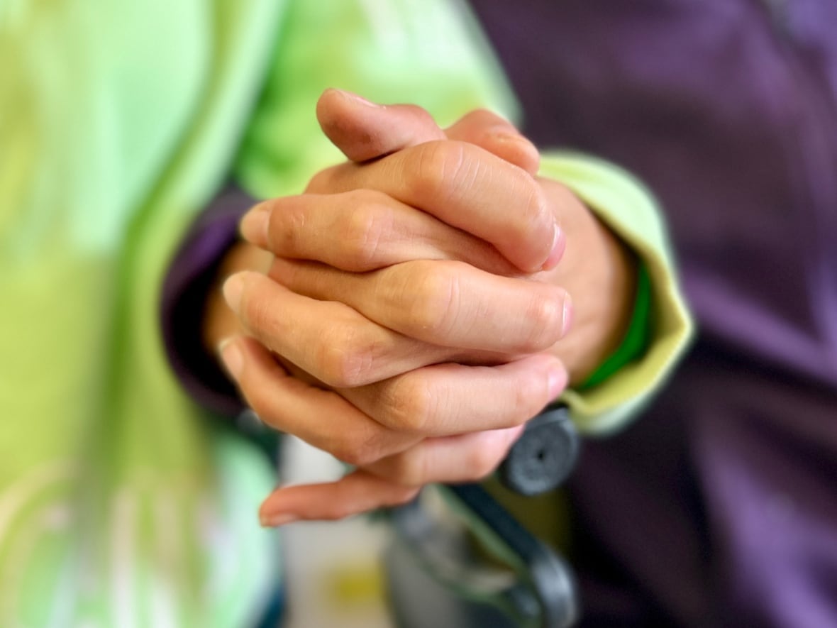 a couple holds hands