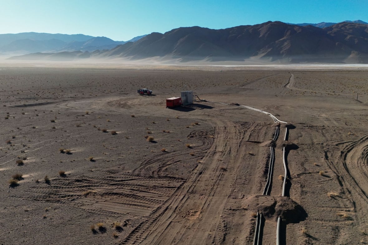An aerial view is shown of a lithium extraction plant.