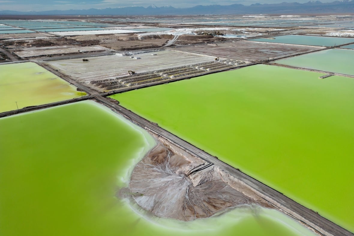 Brine evaporates in pools of a lithium extraction plant facility near Peine, Chile, on April 18, 2023.