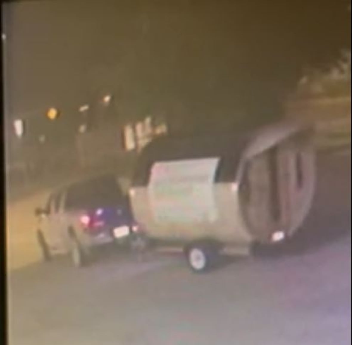 A truck is driving a barrel-shaped sauna.