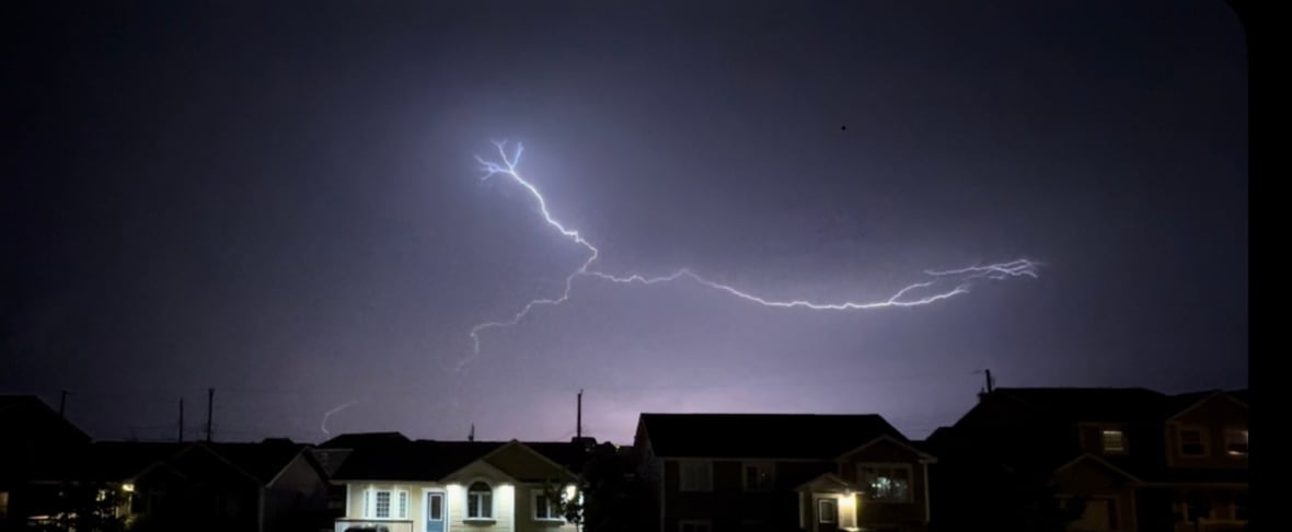 Lightning flash in black and purple sky