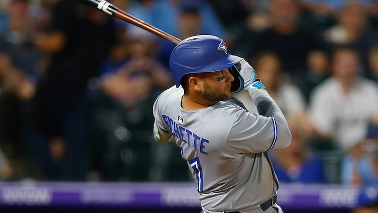 Toronto Blue Jays shortstop Bo Bichette hits a three-run home run in the seventh inning against the hometown Colorado Rockies at Coors Field on August 4, 2025 in Denver.