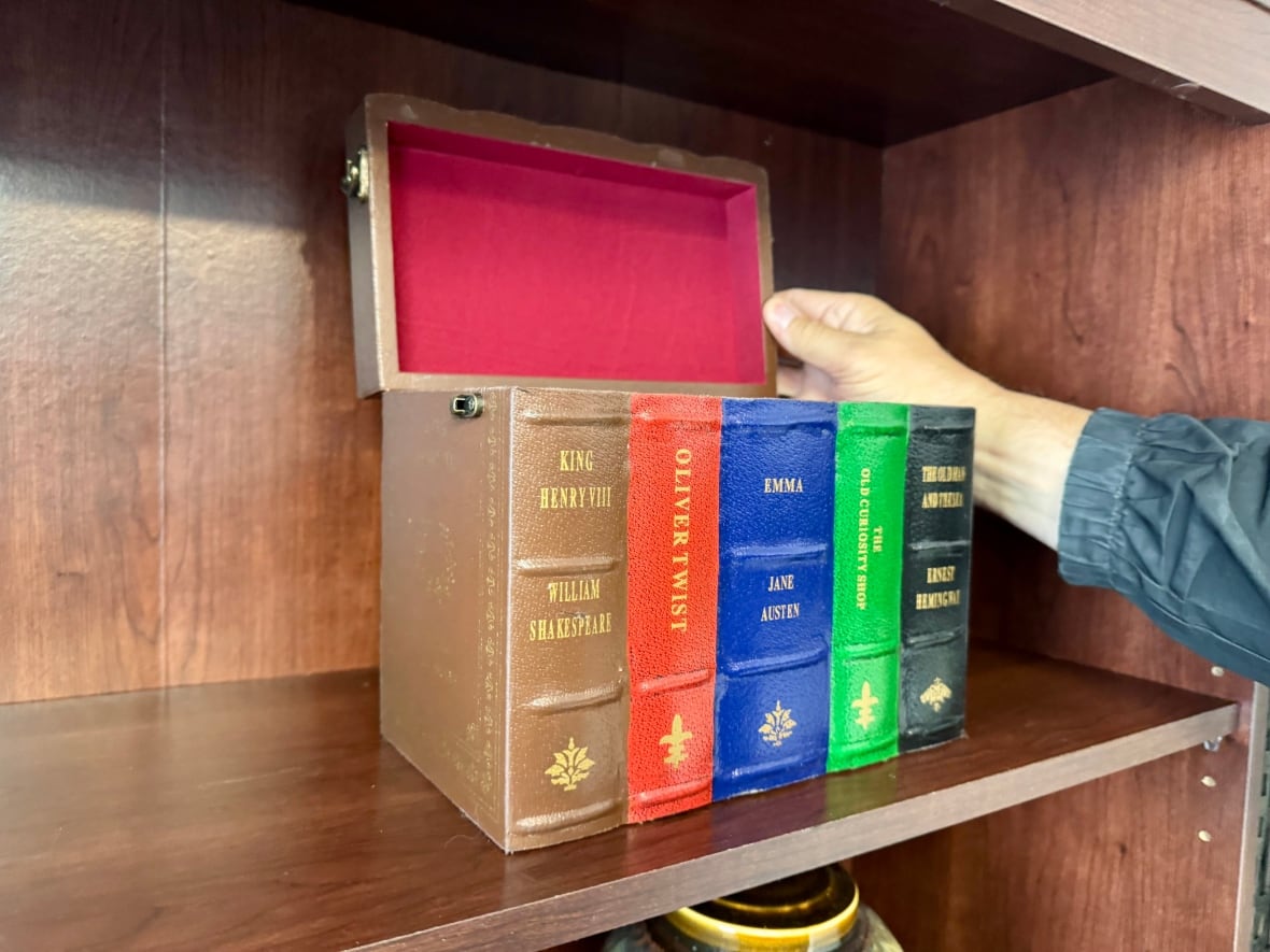 Urn that looks like a stack of books.