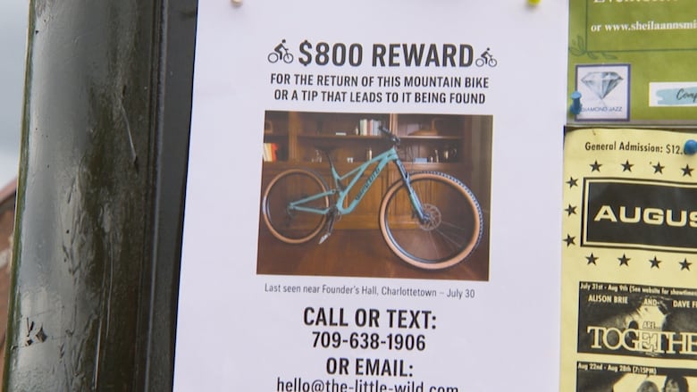 A poster with an image of a bike on it that reads "$800 reward for the return of this mountain bike or a tip that leads to it being found."