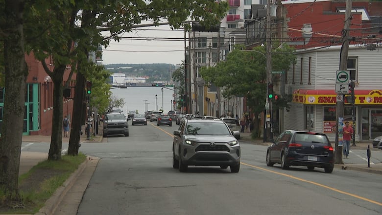 An intersection in a city with cars on the street