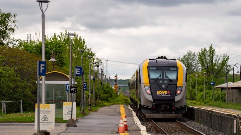 A Via Rail train is seen on tracks in Dorval, Que., as it heads out of Montreal on Friday, May 23, 2025. 
