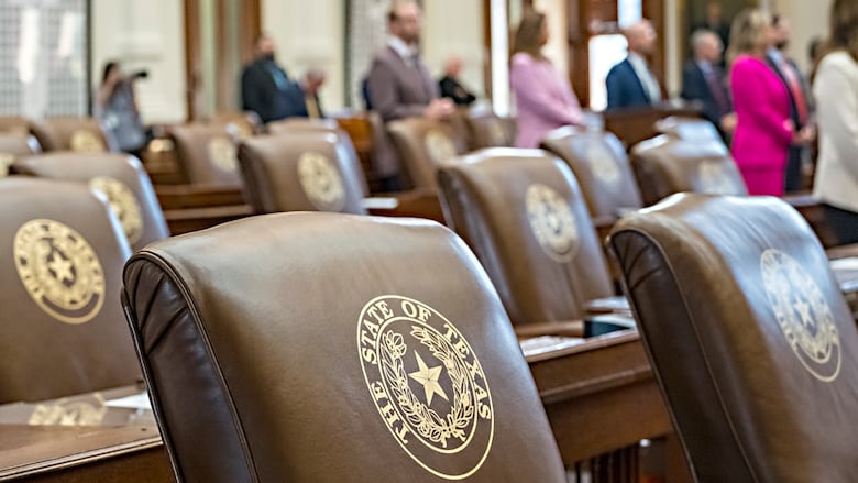 Empty chairs belonging to House Democrats remain empty during session convocation in the State Capitol, Tuesday, Aug. 5, 2025, in Austin, Texas.