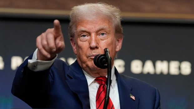 President Donald Trump answers questions from reporters after signing an executive order about the 2028 Los Angeles Olympic Games