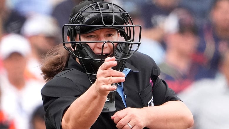 Home plate umpire Jen Pawol calls a strike during the third inning of a spring training baseball game between the Miami Marlins and Houston Astros on March 10, 2024 in West Palm Beach, Florida.