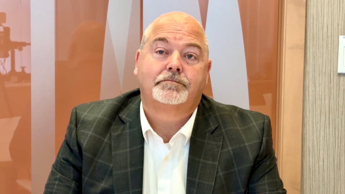 A man sits in an office.