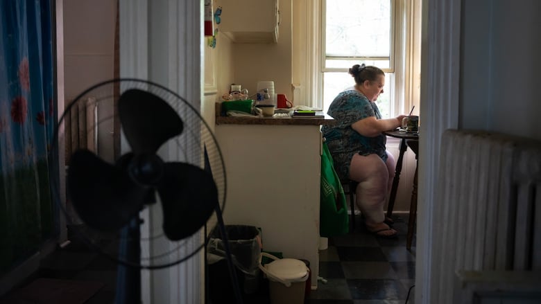 woman seated at kitchen table