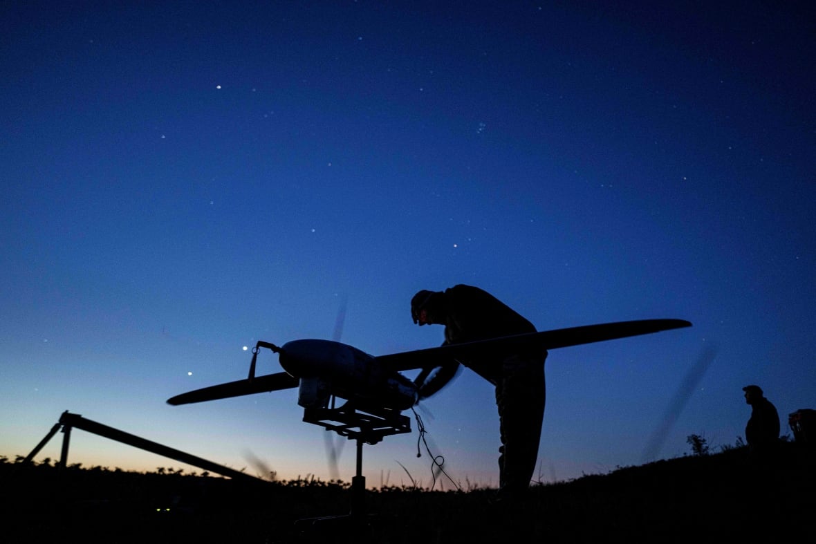 A Ukrainian soldier prepares a drone for flight, from a frontline location near Pokrovsk, Ukraine.