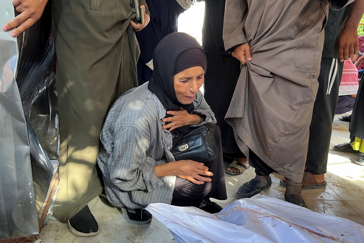 A woman interacts during the funeral.