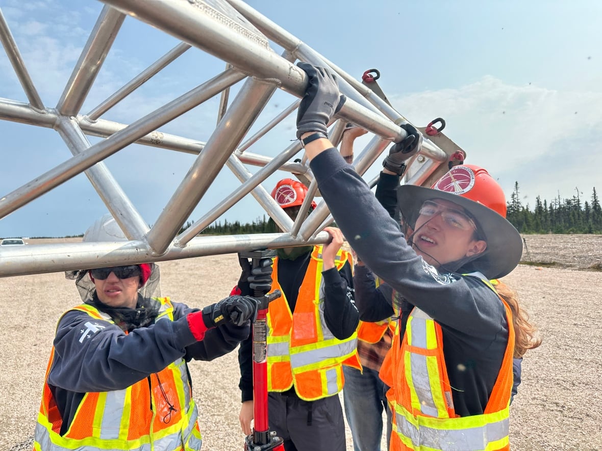 Space Concordia Rocket Division assembling a rocket tower.