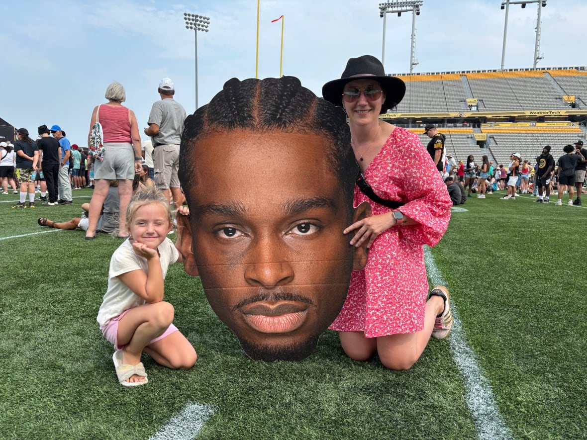 Six-year-old Frankie Kelly and her mom, Melanie Inrig, are seen at a Hamilton event honouring Shai Gilgeous-Alexander on Aug. 7, 2025.