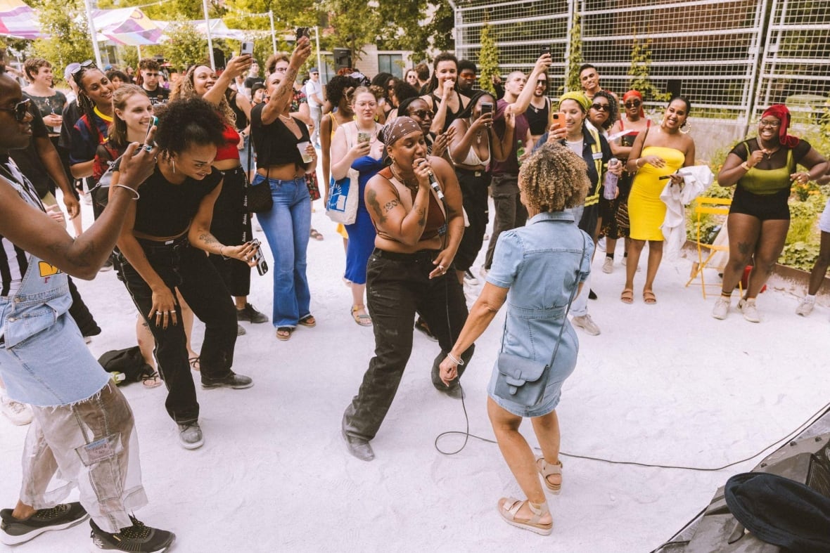 People dancing at an event. 