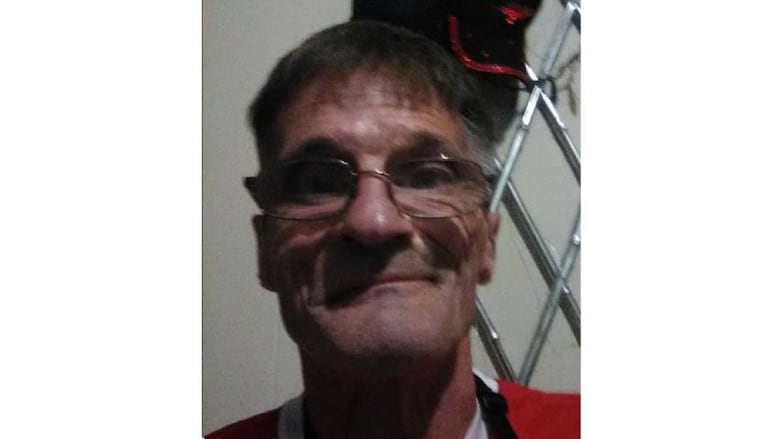 An image of a man wearing glasses