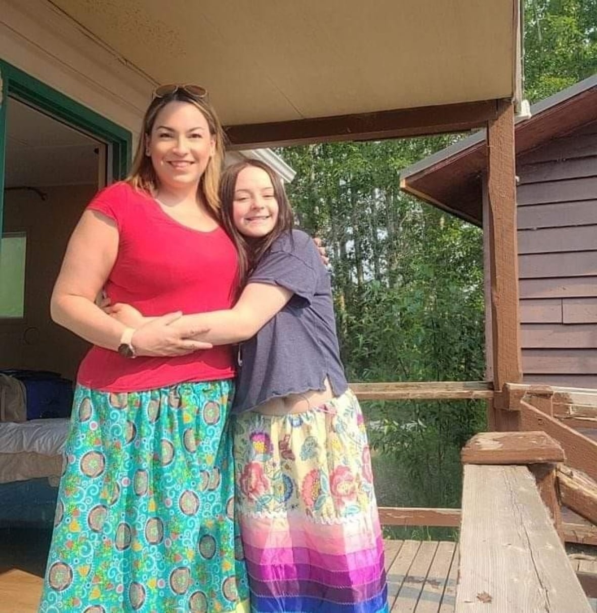 mom and daughter hugging
