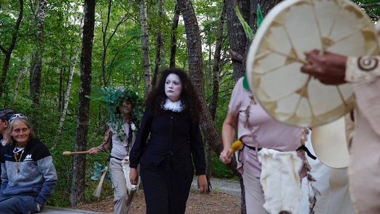 Woman in costume in woods