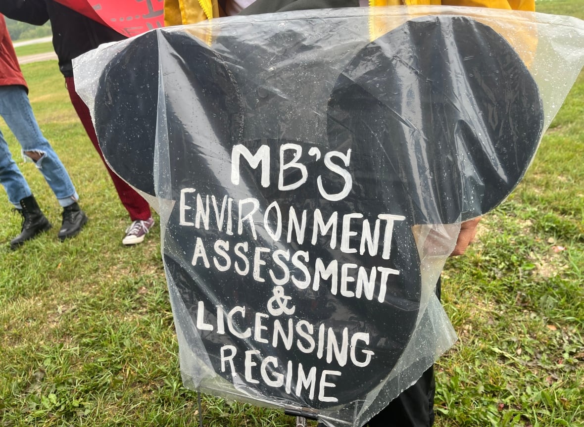 An outline of Mickey Mouse's face bearing the words "Manitoba's environment assessment and licensing regime."
