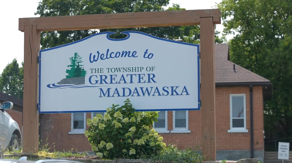 A sign reads "Welcome to the Township of Greater madawaska"