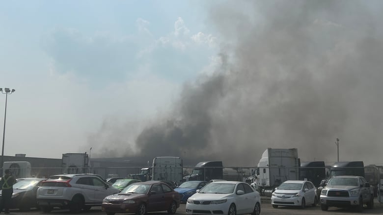 smoke rising from industrial area