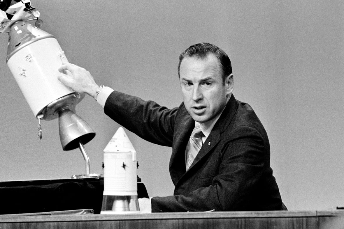 NASA James Space Pioneers (Jim) Loville points during a televised press conference signed on April 21, 1970.