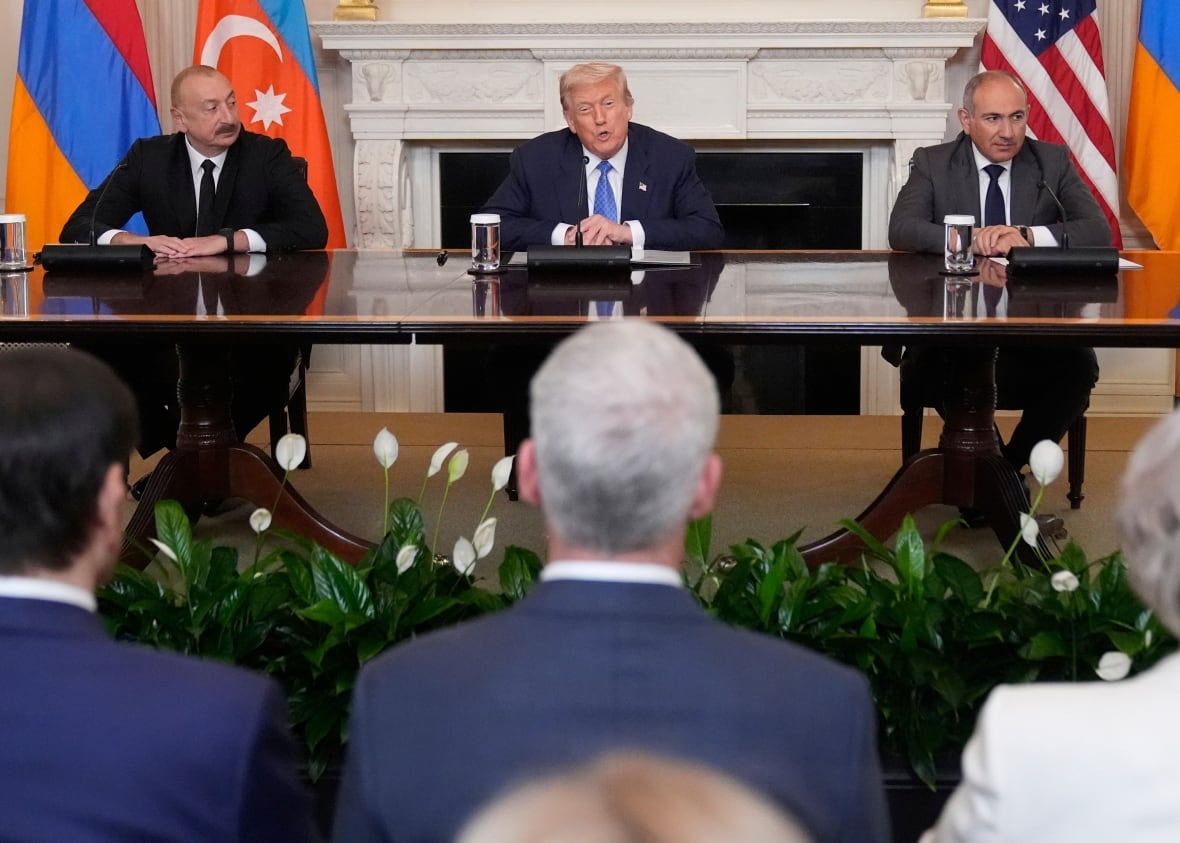 US President Donald Trump, the center, speaks during a triple signing ceremony with Azerbaijan President Ilham Aliyev, to the left, and Prime Minister in Armenia Nicole Pashinan.