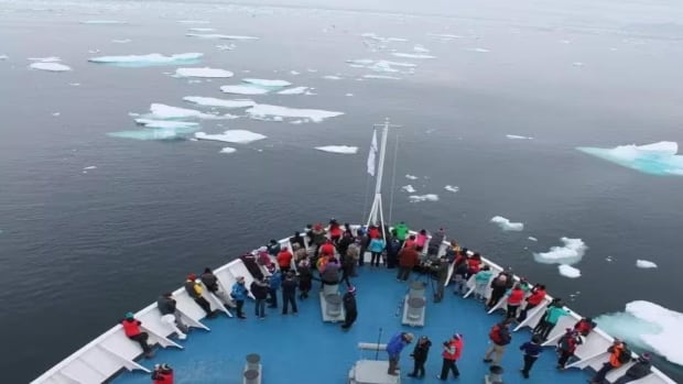 ship with dozens of people on the bow
