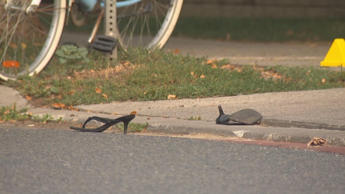 Heels are seen on the scene of a crime, on the side of the street